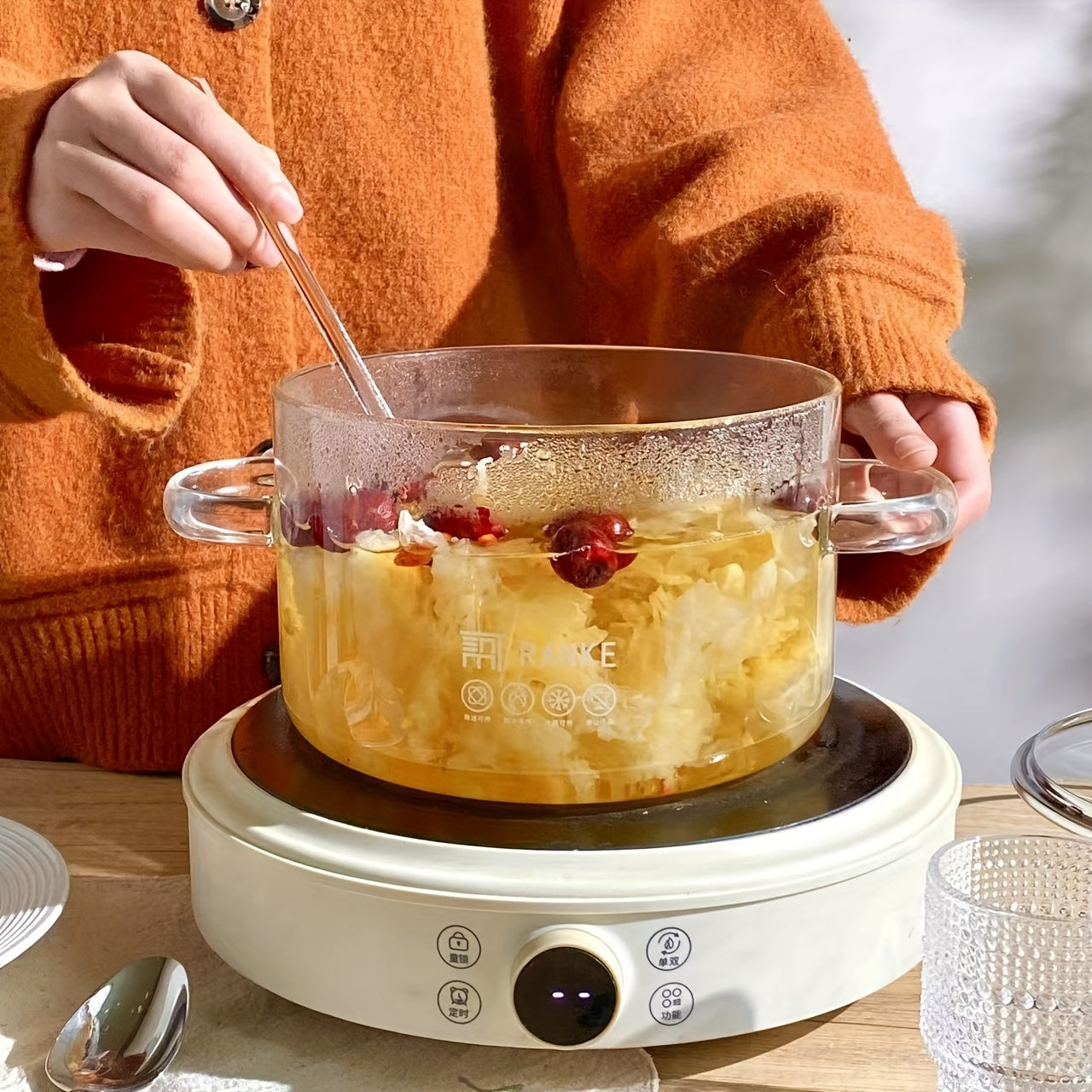 Transparent stovetop cooking pot made of borosilicate glass with seal finish, suitable for induction cooking. A kitchen gadget accessory that requires no power.