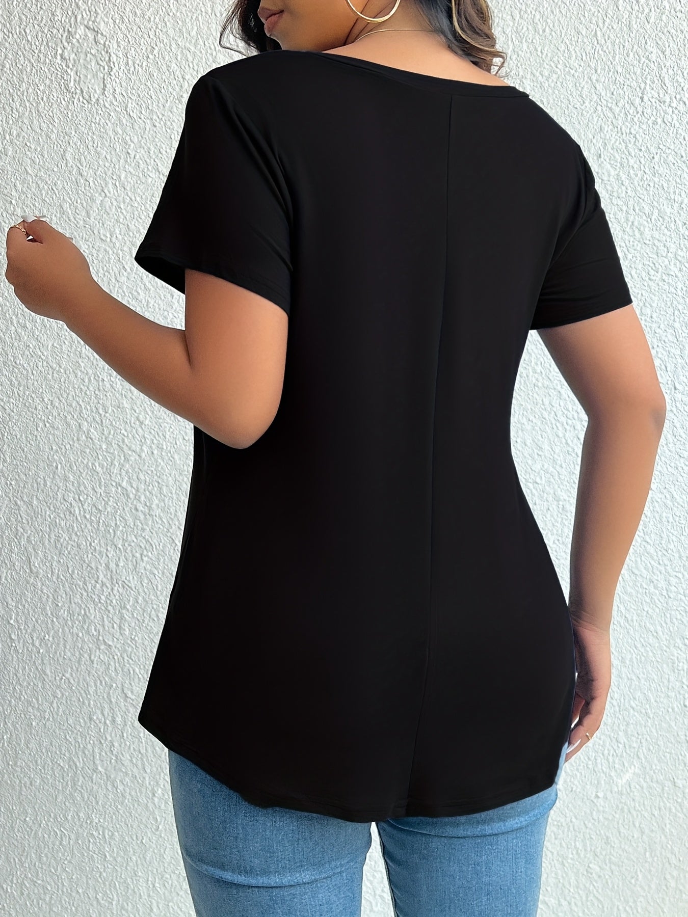 Chic black V-neck t-shirt for plus size women, made from soft polyester and elastane blend. Machine washable and flattering hemline, essential summer wear.