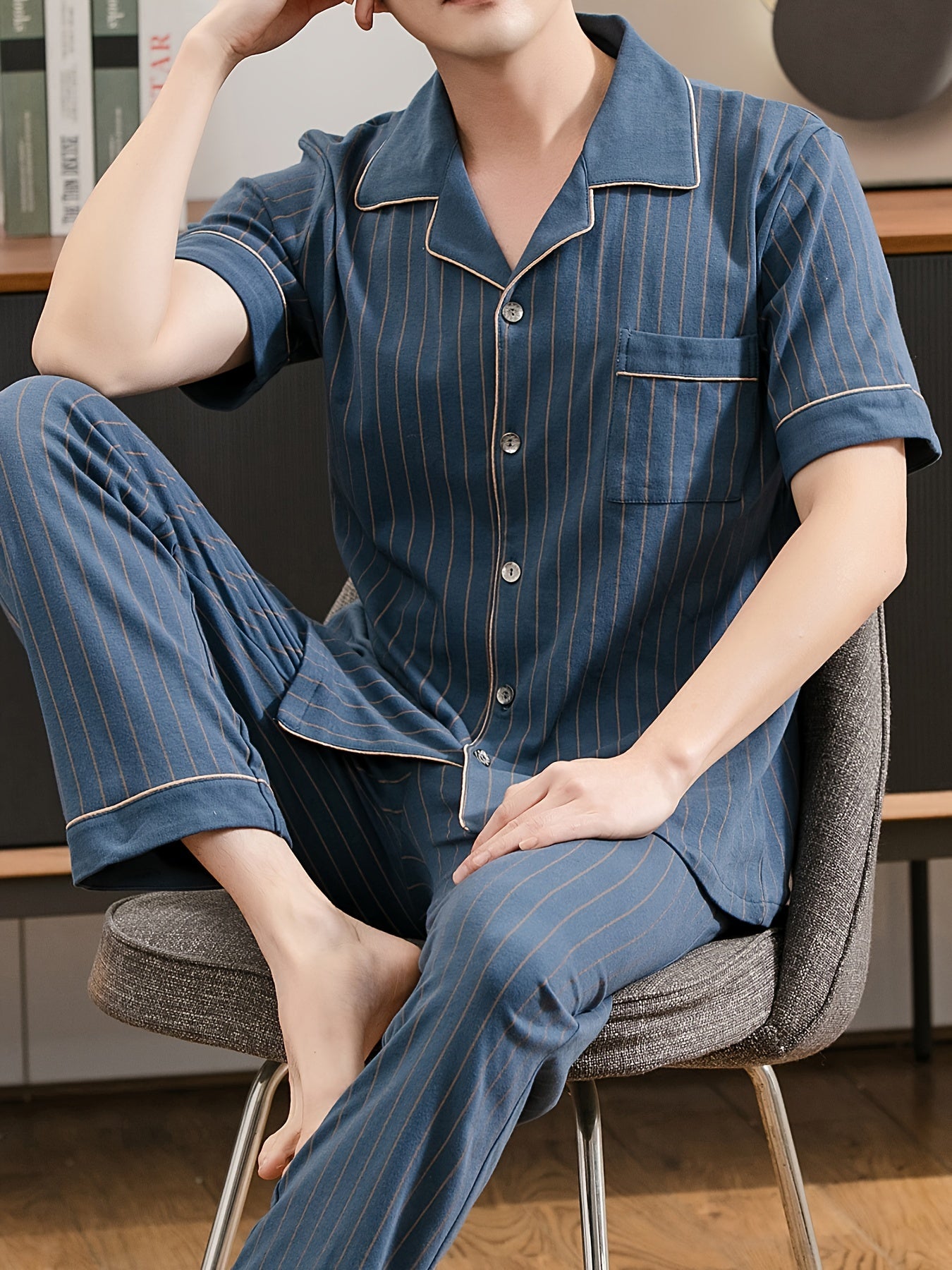 Men's navy blue stripe print pajama set with lapel collar, short sleeves, and trousers. Comfortable and skin-friendly cotton fabric for cozy loungewear.