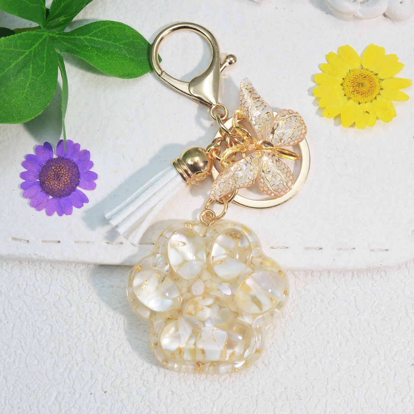 Butterfly tassel ladies bag keychain pendant in the shape of a cat's paw, perfect as a birthday or holiday gift for a creative animal lover.