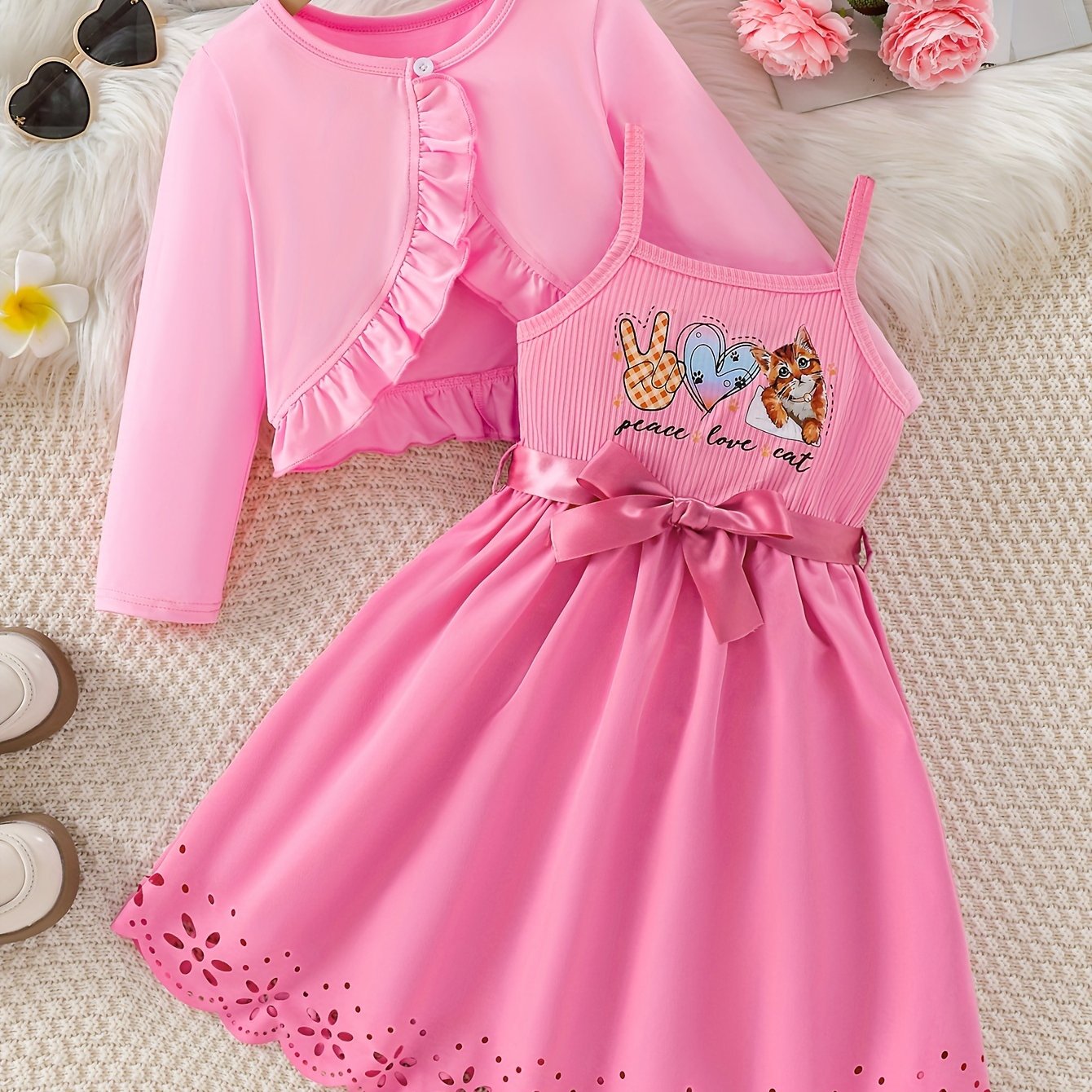 Cute 2-piece set includes frilled long sleeve cardigan top and cat print cami dress. Perfect for spring/fall outdoor activities, as a girls outfit, or as a gift.