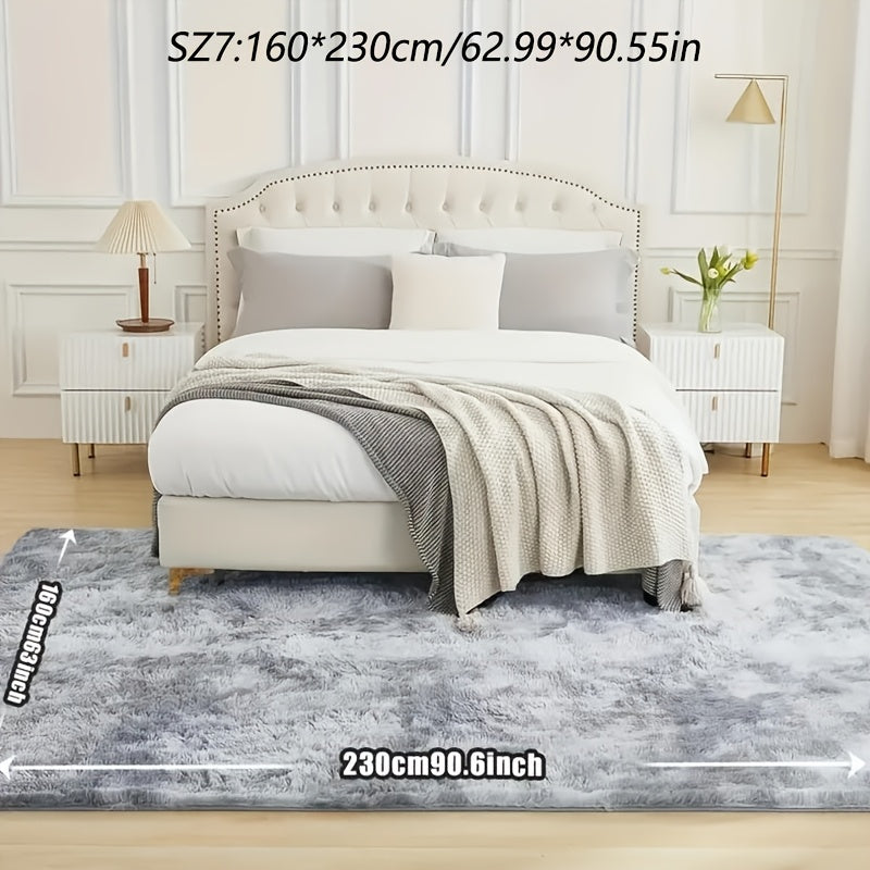 A stylish light grey tie-dye gradient plush carpet perfect for your living room, coffee table, or bedside. This long-haired washable mat is ideal for adding a touch of Nordic style to your bedroom.