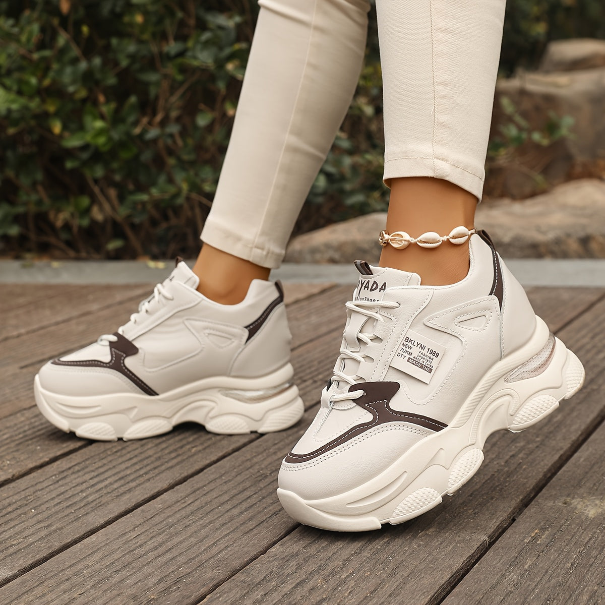 Chunky sneakers for women featuring a casual lace-up design and trendy wedge sports shoes.