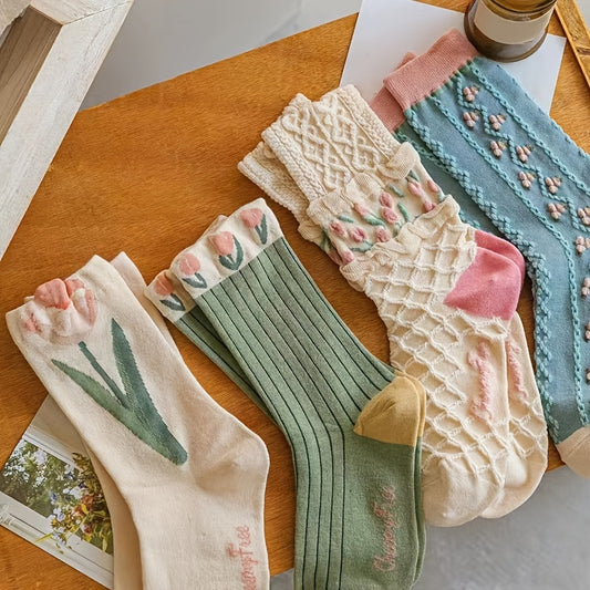 4 pairs of floral socks for women with cute flower and geometric designs, made from a textured fabric blend in a cottagecore style.