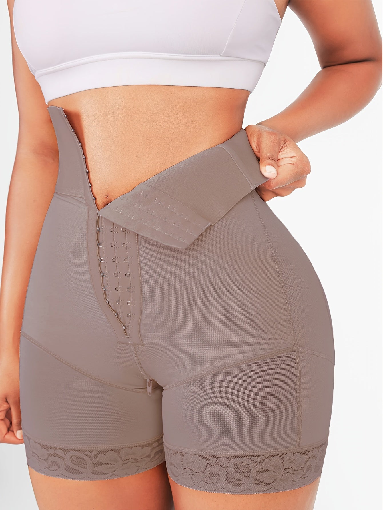 Compression tummy control panties with high waist and butt lifter for shaping the body.