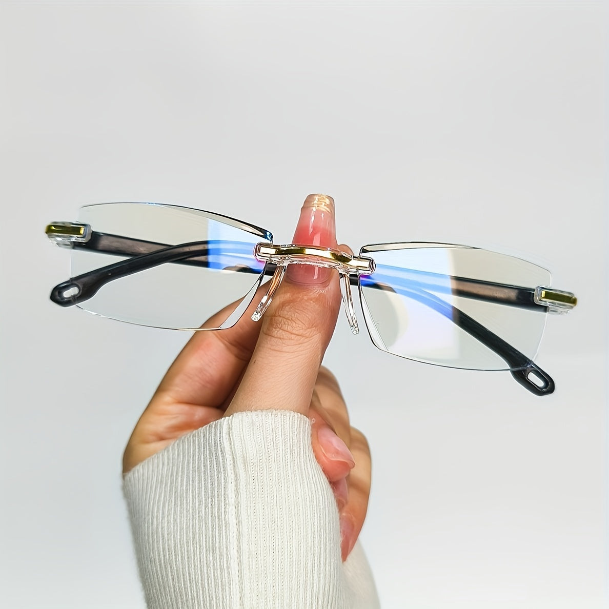 4 Rimless Blue Light Blocking Reading Glasses for Men and Women, designed to reduce eyestrain.