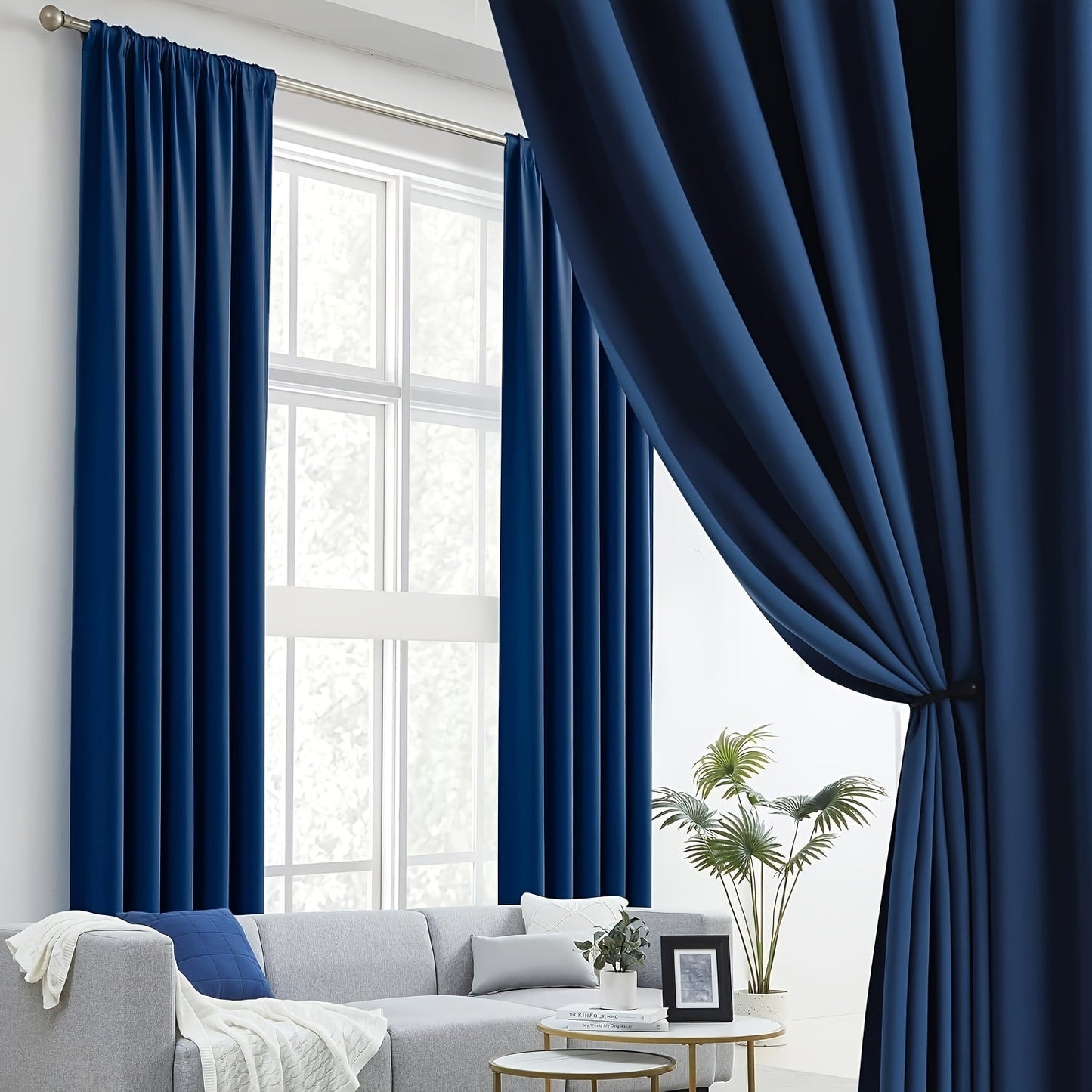 Two pieces of contemporary blackout curtains made from thermal insulated twill weave polyester. They are designed to reduce noise and block out light, making them perfect for the living room, bedroom, or study. These curtains feature a hook and ring rod