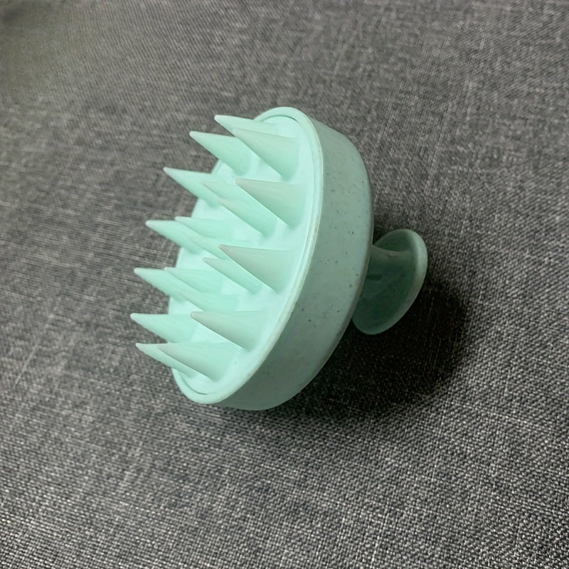 Silicone scalp massager with gentle exfoliating shampoo comb. No batteries needed, comes in 3 colors.