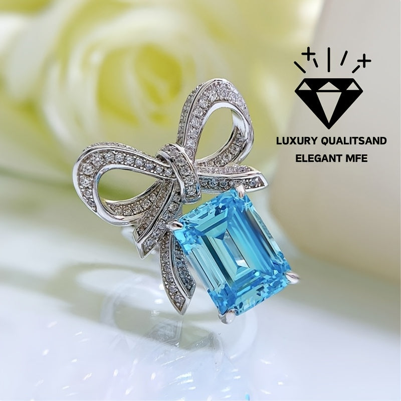 New for 2024, this stunning butterfly ring features a 9*12 aquamarine stone set in high carbon silver. Perfect for a female recipient, this ring comes in a random gift box style.