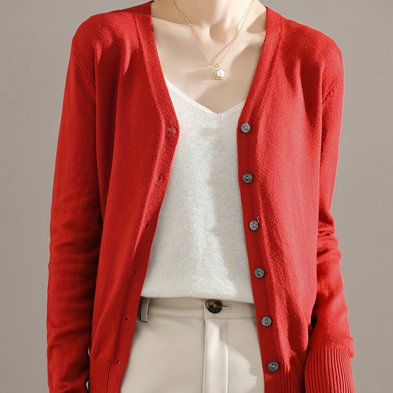 Chic V-neck cardigan with long sleeves, perfect for spring and fall.