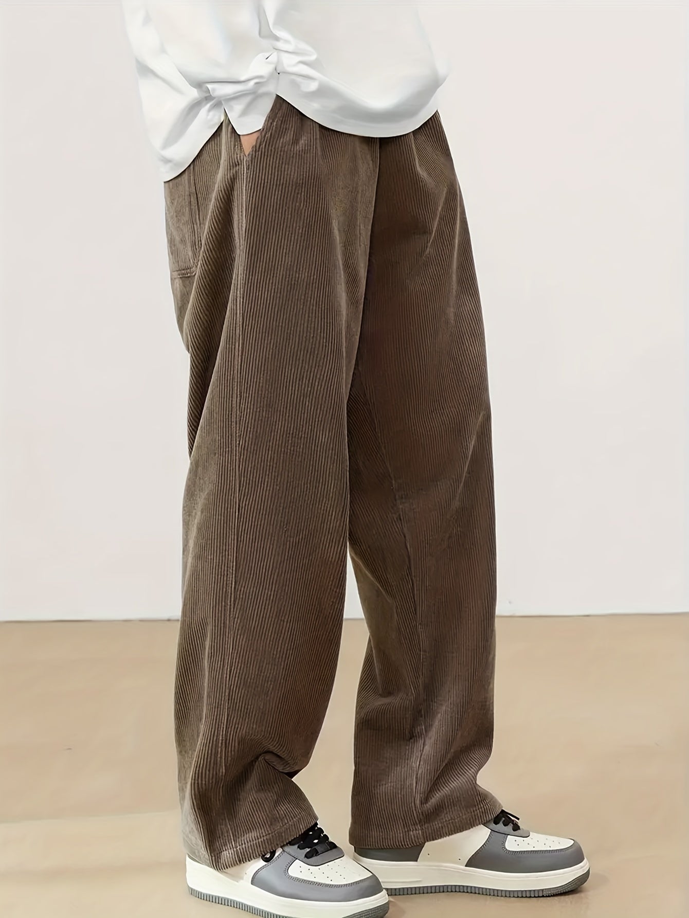 Men's casual corduroy pants with drawstring waist, ideal for outdoor activities and commuting.