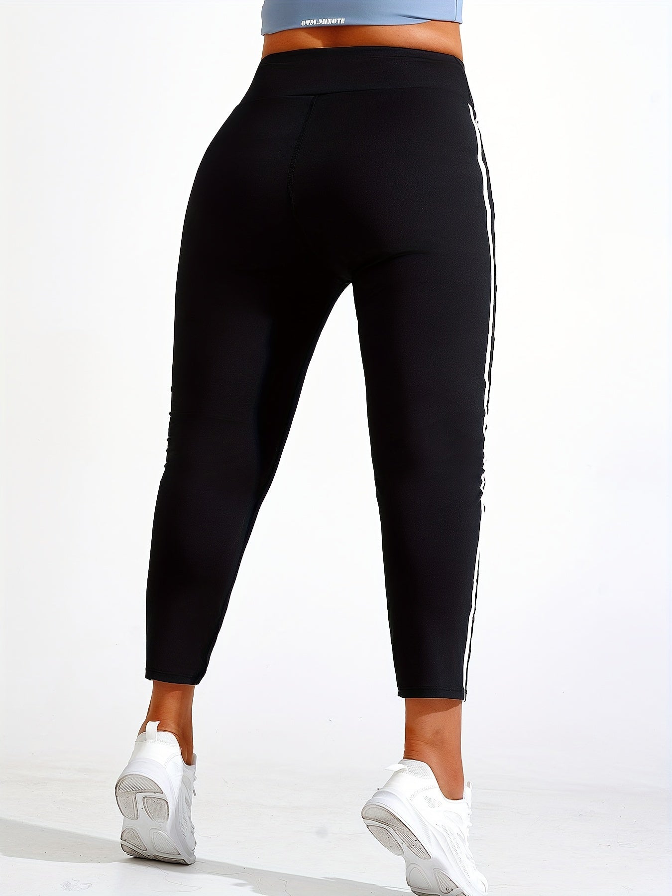 Plus size yoga pants for women, solid color, slimming fit, machine washable, long length, made of stretch polyester and elastane.