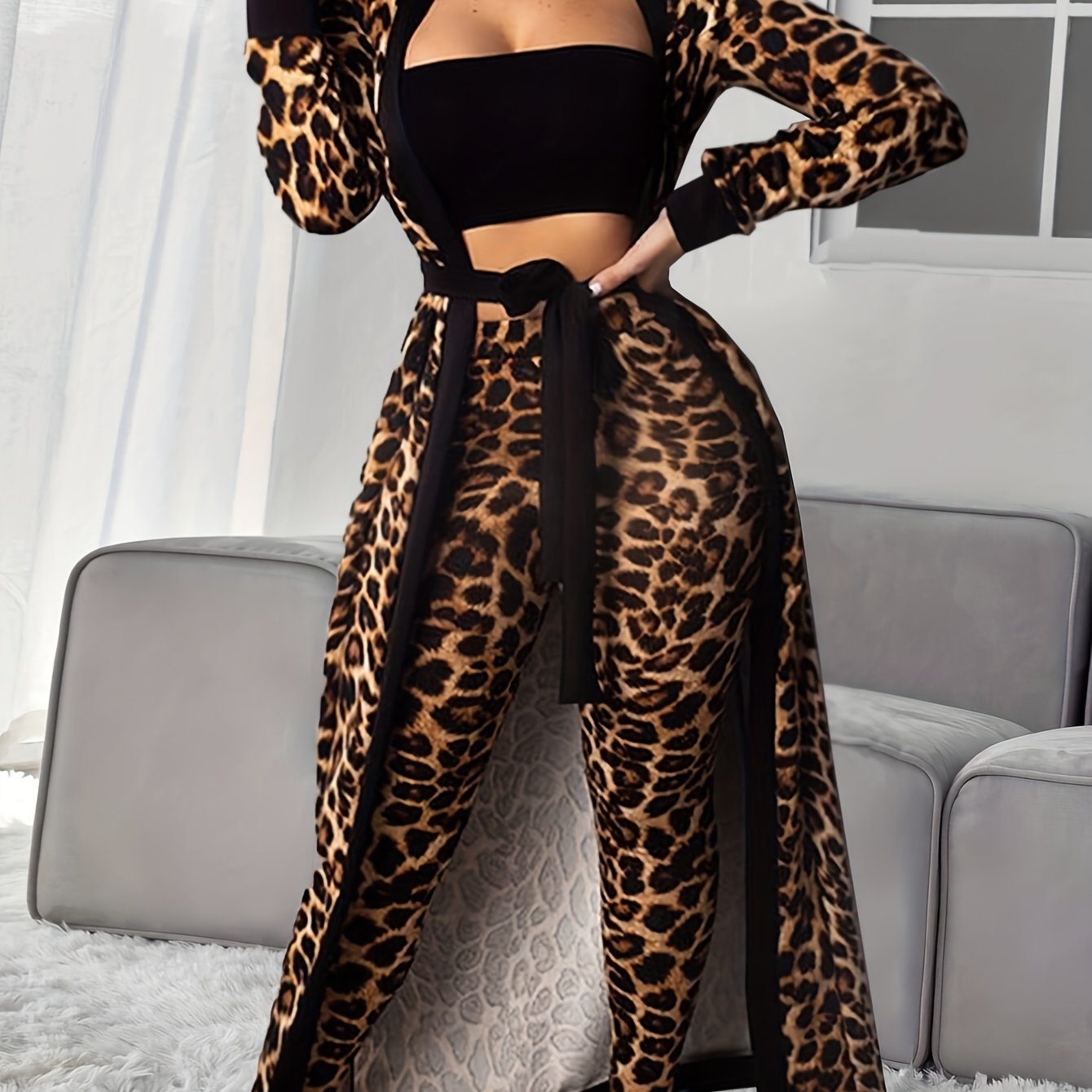 Women's loungewear set includes leopard print robe with belt, strapless crop top, and pants.