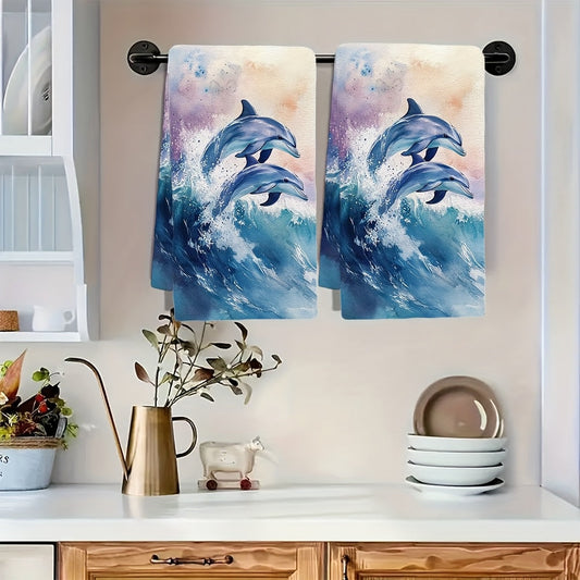 Two pieces of ultra soft kitchen towels featuring a playful dolphins watercolor design. These highly absorbent and machine washable dish hand towels are perfect for adding a vibrant coastal decor to your kitchen. Each towel measures 40.64x60.96 cm.