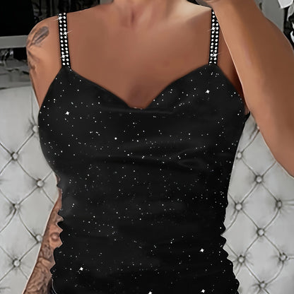 Sleek black sequin cami with rhinestone straps. V-neck, sleeveless, machine washable polyester knit. Stylish and sexy summer top.