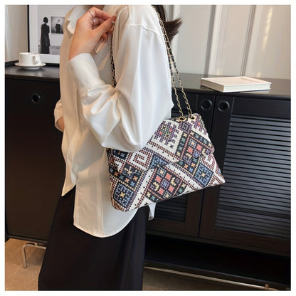 Colorful geometric shoulder bag for women with adjustable strap, magnetic closure, foldable ethnic style, and polyester lining.