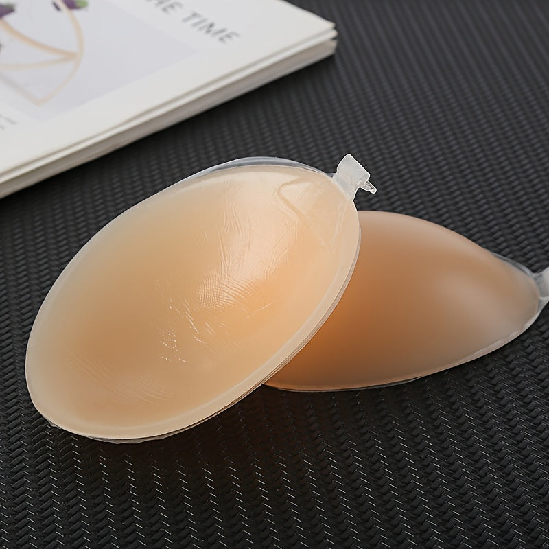 Invisible silicone strapless bra with self-adhesive backless push-up nipple covers for women. lingerie and underwear accessory.