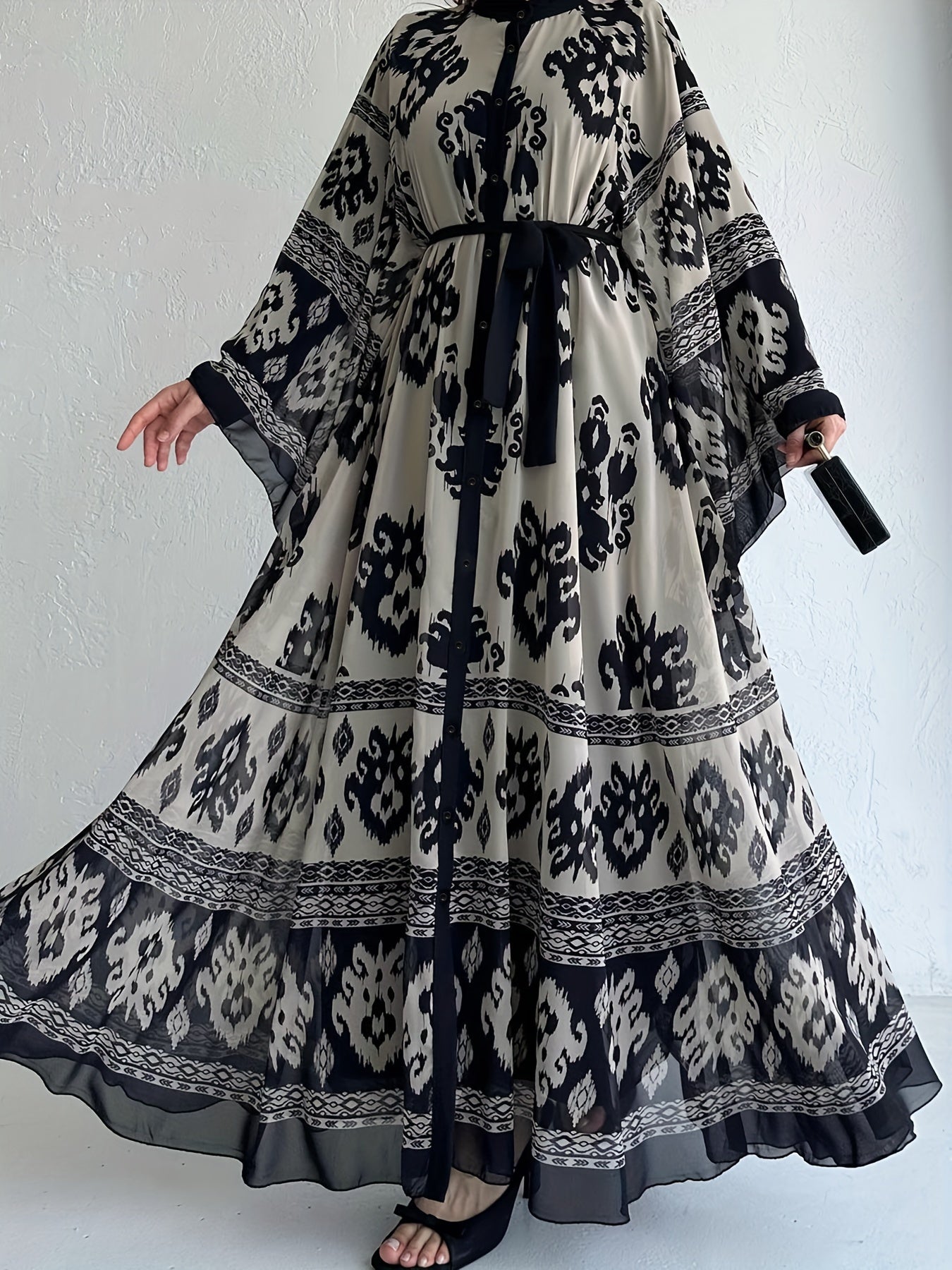 Allover print belted maxi dress with crew neck, bell sleeves, and pleats for spring & fall. Women's clothing.