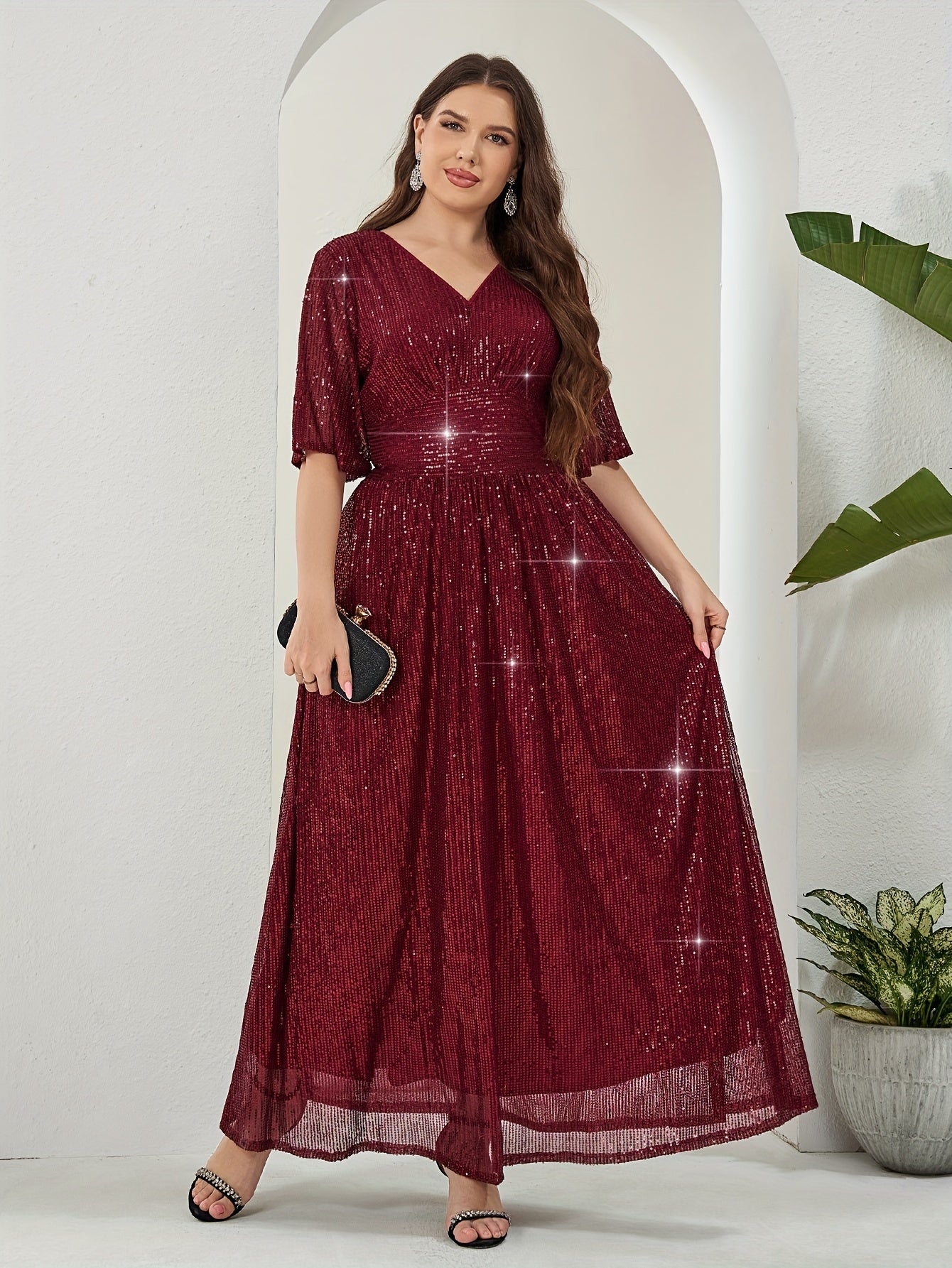 Elegant plus-size sequin maxi dress with v-neck and half sleeves. Made of non-sheer polyester with zip detail. Suitable for all seasons.