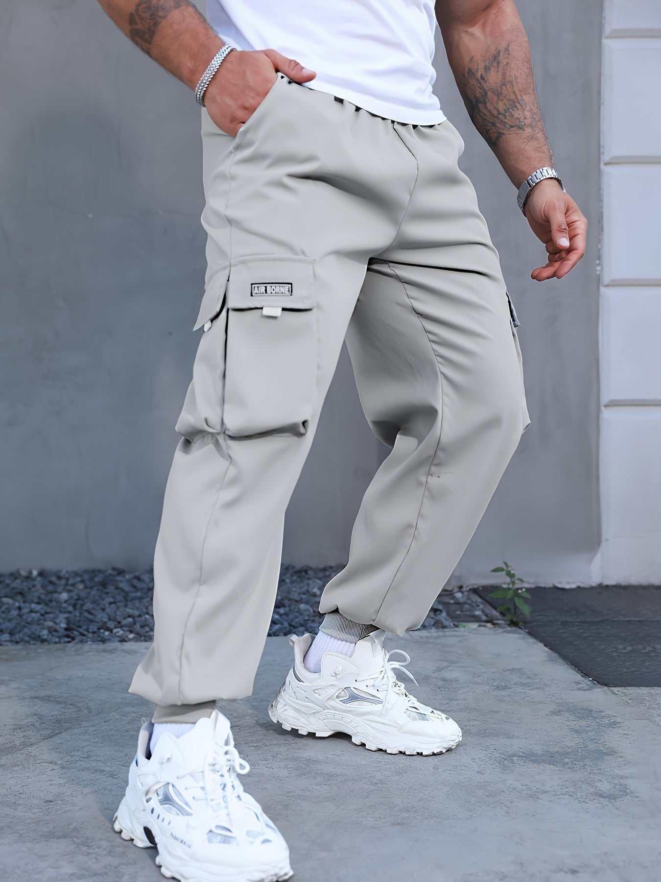 Japanese men's casual work pants with multiple pockets and loose, tied feet for spring 2023