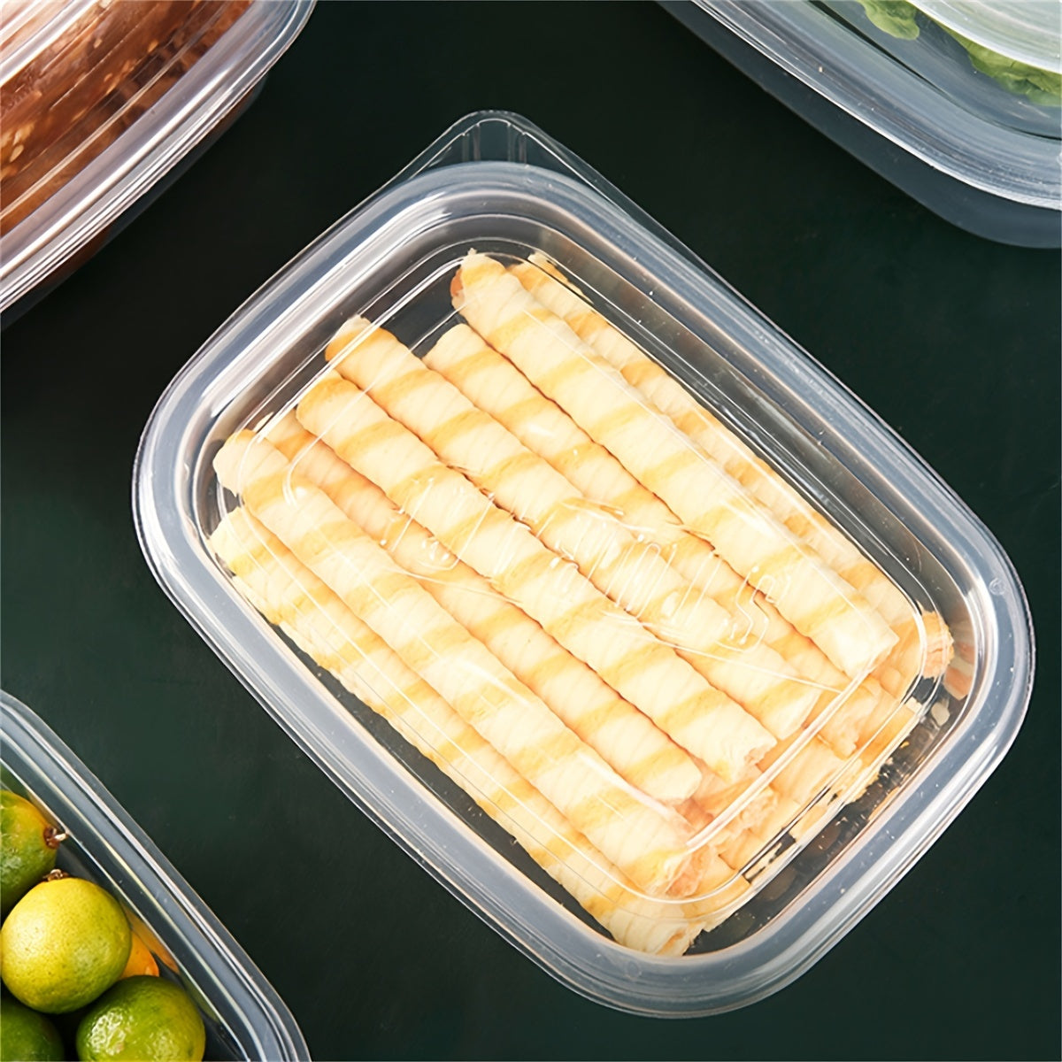 Pack of ten 24-ounce clear plastic meal prep containers that are safe for use in the microwave and dishwasher. These rectangular lunch boxes come with lids in random colors and are reusable.