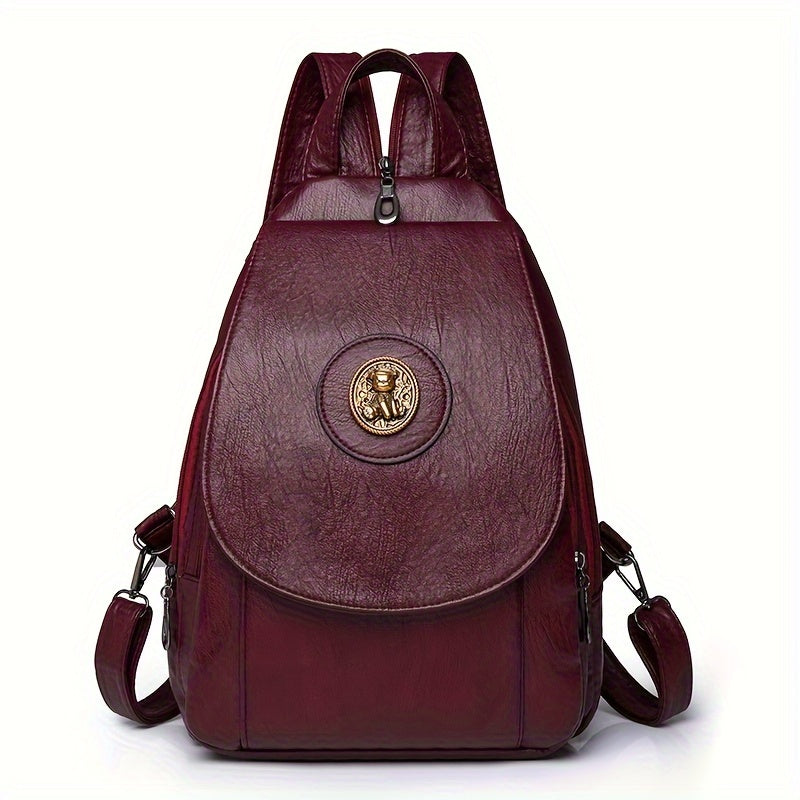 Women's retro-style synthetic leather backpack with adjustable straps, multiple compartments, magnetic closure, and denim design in brown, beige, or black for daily or work use.