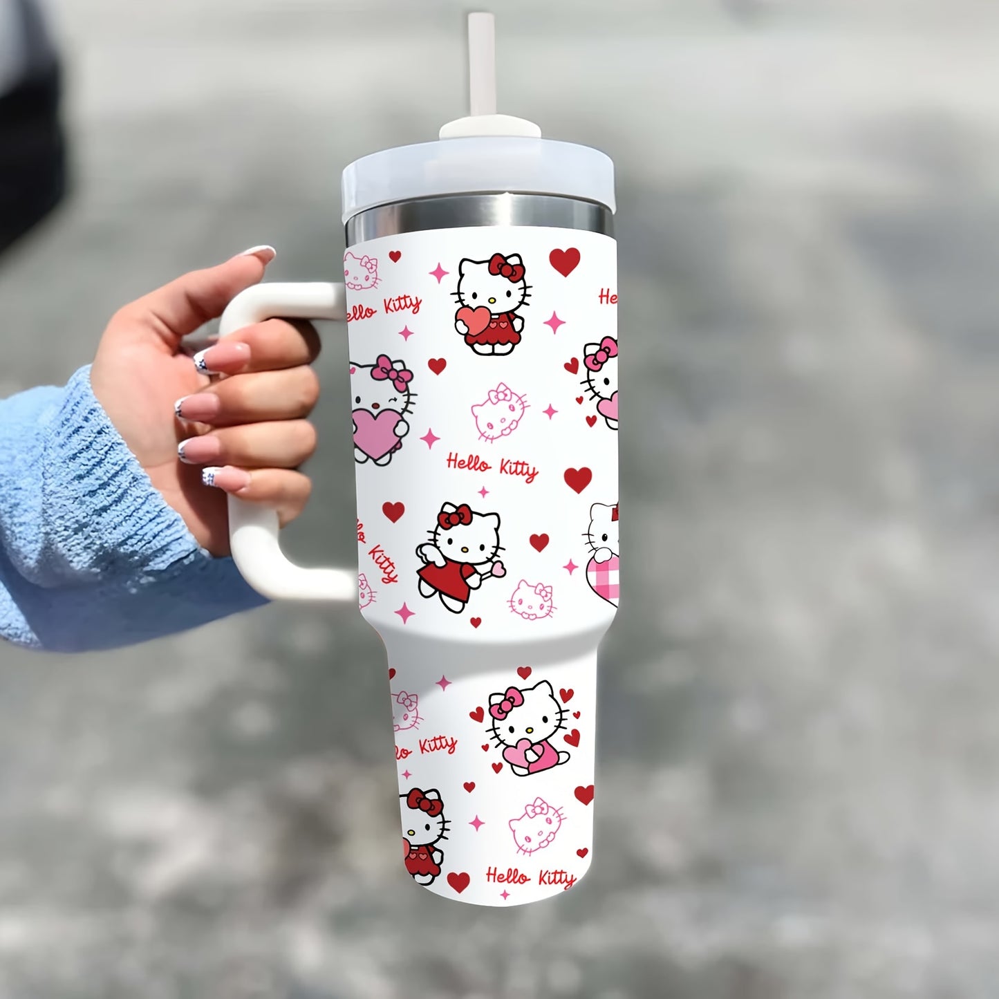 40oz Hello Kitty insulated stainless steel water bottle with handle and straw. Pink & white heart pattern, BPA-free, ideal for hot/cold drinks. Great gift for family & friends.