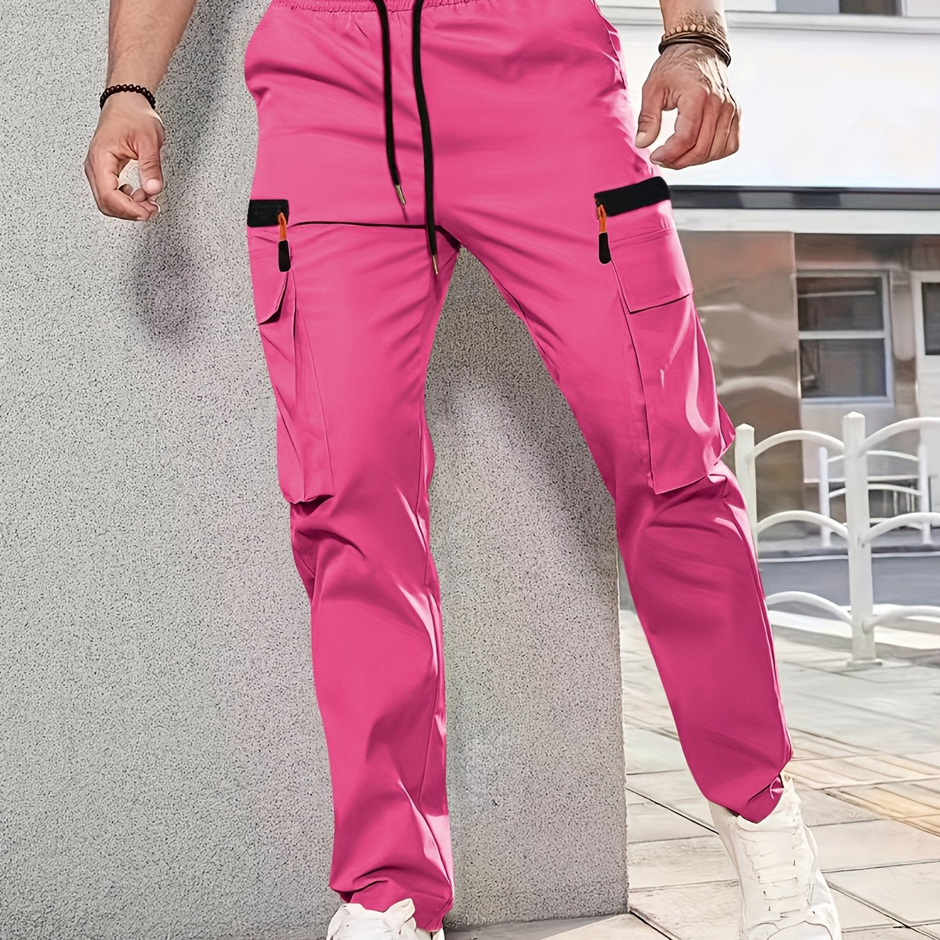 Men's casual cargo pants made of solid color polyester, feature a regular fit, multiple pockets, and straight-leg design for sports and leisure activities all year round.