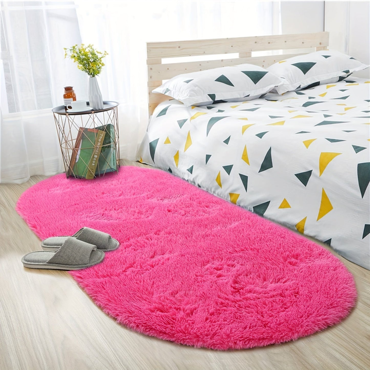 Soft and fluffy oval shaggy area rug, perfect for bedroom or living room. Made with skin-friendly thickened sponge and tufted polyester material. Durable and easy to maintain. Adds decorative touch to indoor spaces such as sofa, bedside, playroom, or