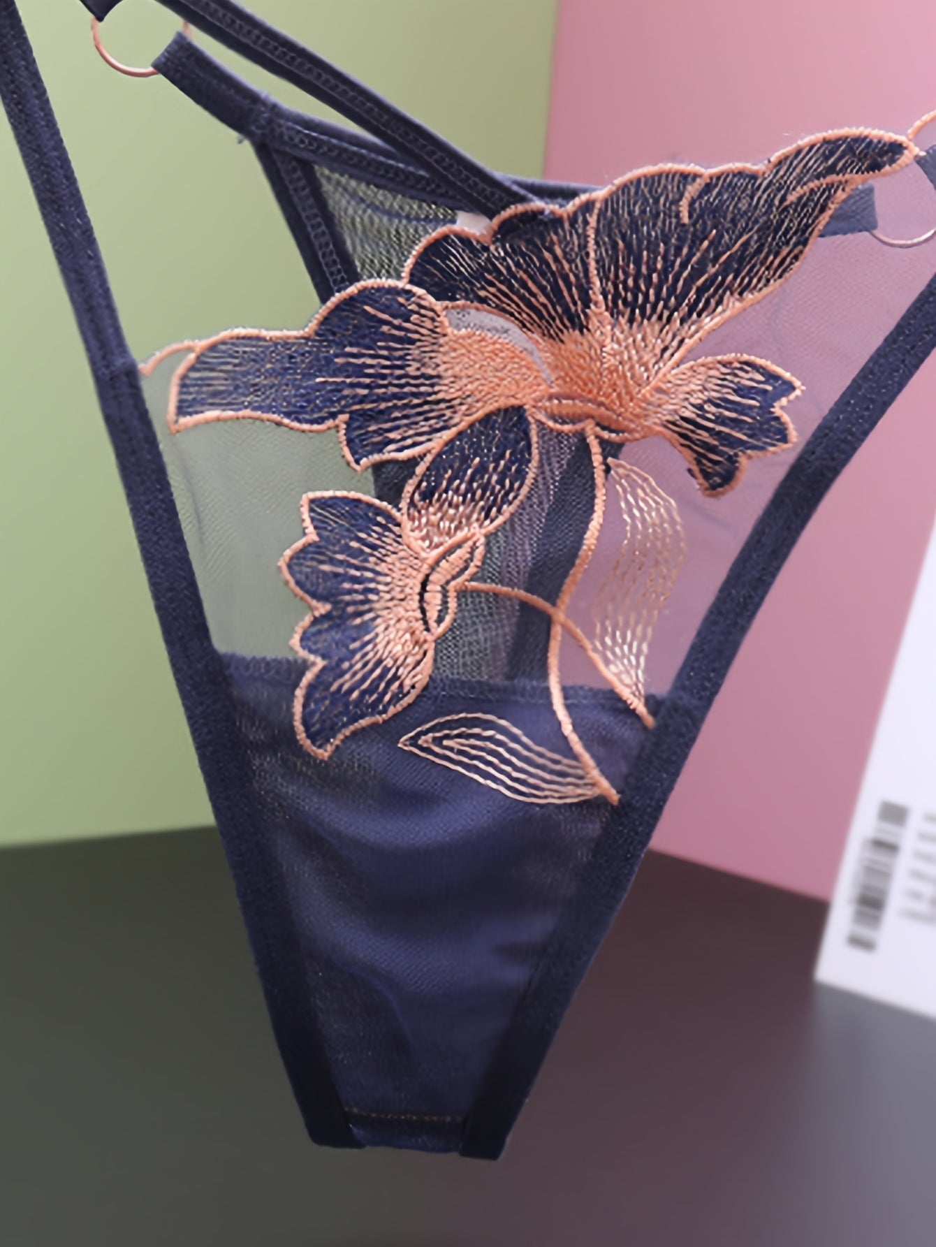 Sexy lingerie and underwear for women, including floral embroidered thongs and seamless mesh panties.