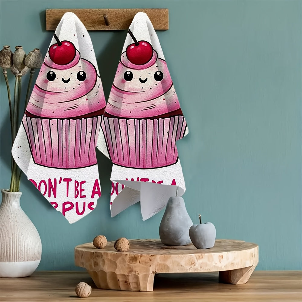 2 pieces of ultra soft kitchen towels featuring a "Don't Be A Sourpuss" cupcake design. These highly absorbent and machine washable dish hand towels have a contemporary style with pink and white stripes. Measuring 40.64x60.96 cm, they are perfect for