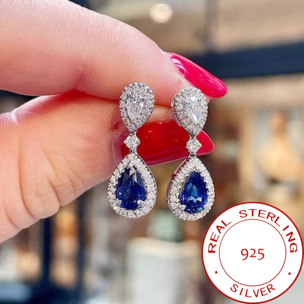 Exquisite and premium jewelry designed for women, showcasing a stunning water drop-shaped silvery earring adorned with shimmering zirconia stones. This elegant piece weighs around 3.9 grams and is ideal for special occasions and evening gatherings. A