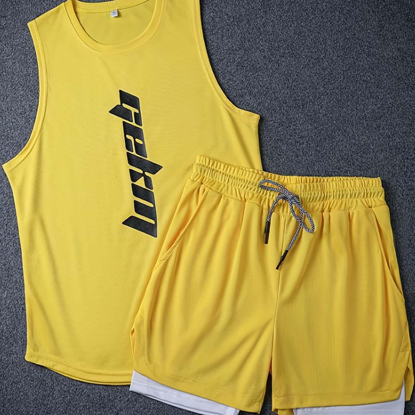 Men's 2-piece fashion set with letter print tank top and drawstring shorts.