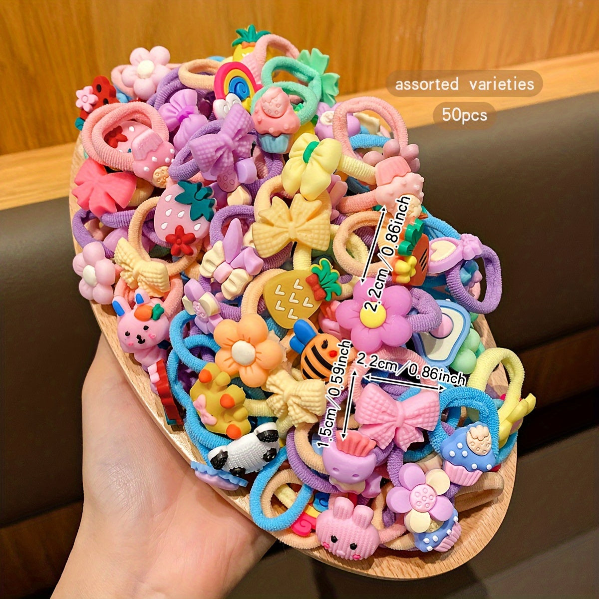 50 cute cartoon styles of randomly assorted rubber bands; sweet and stylish hair accessories for daily use.