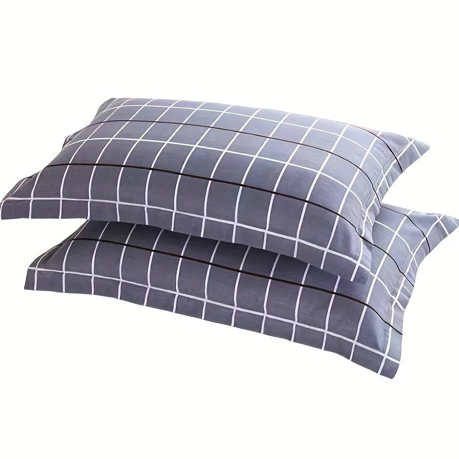 Two soft brushed pillow covers with a geometric plaid design and envelope closure - ideal for adding a touch of style to your bedroom decor or as a thoughtful Thanksgiving gift idea.