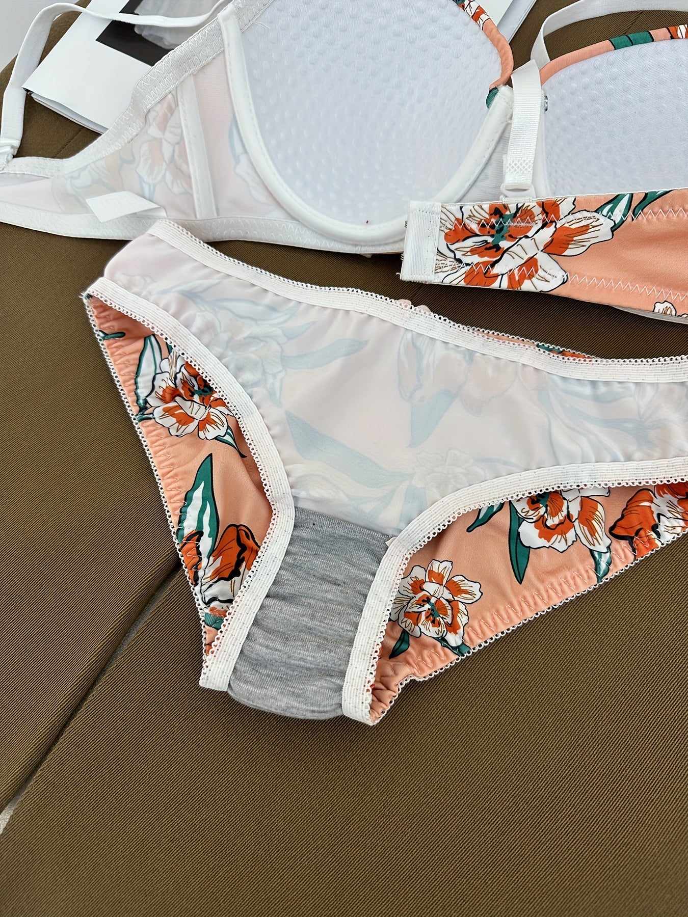 Floral bra and panty set with steel underwire and breast enhancement feature for women.