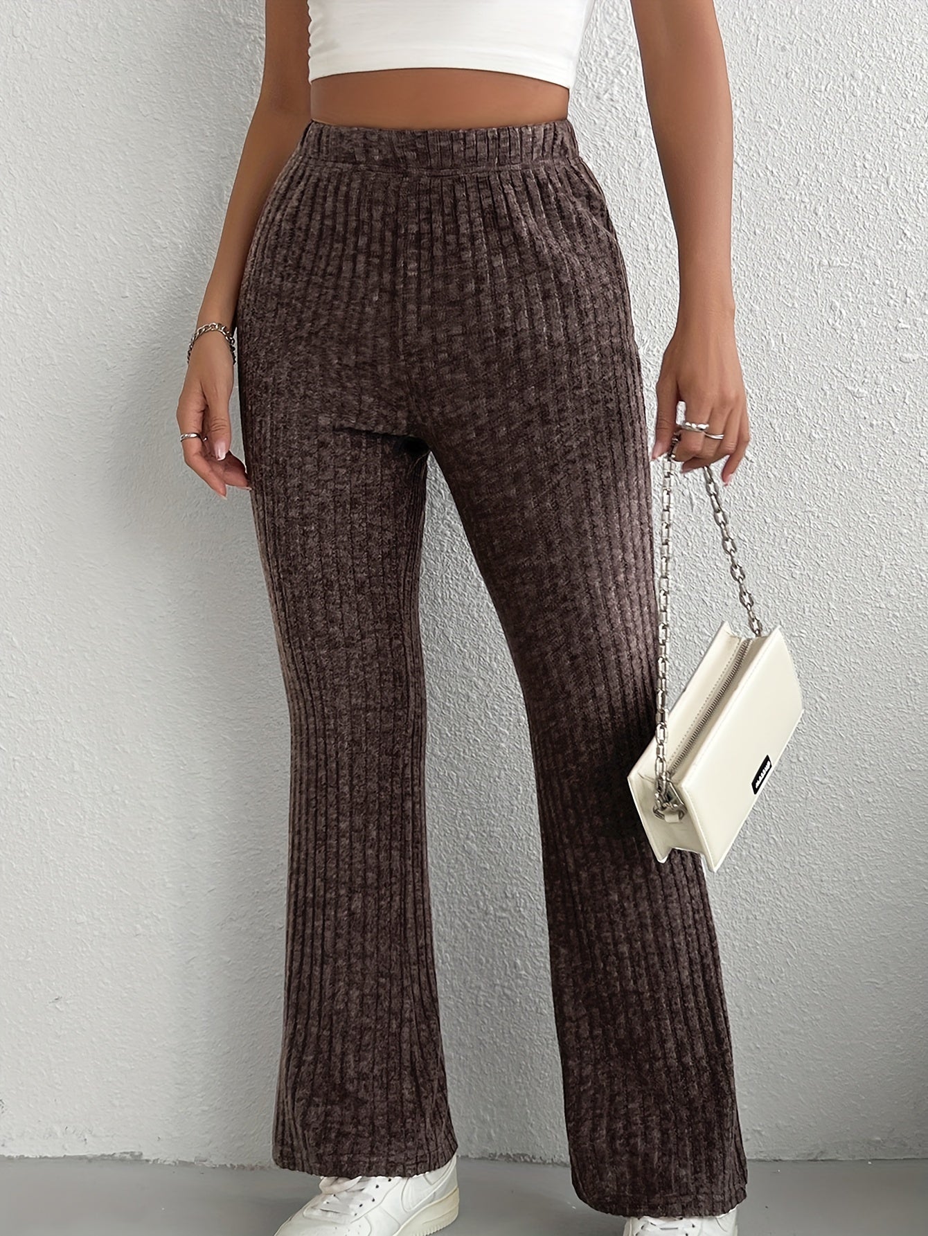 Women's elegant solid color knit flare pants made of a soft and comfortable polyester blend, perfect for all seasons, with a fabric weight of 210g/m².