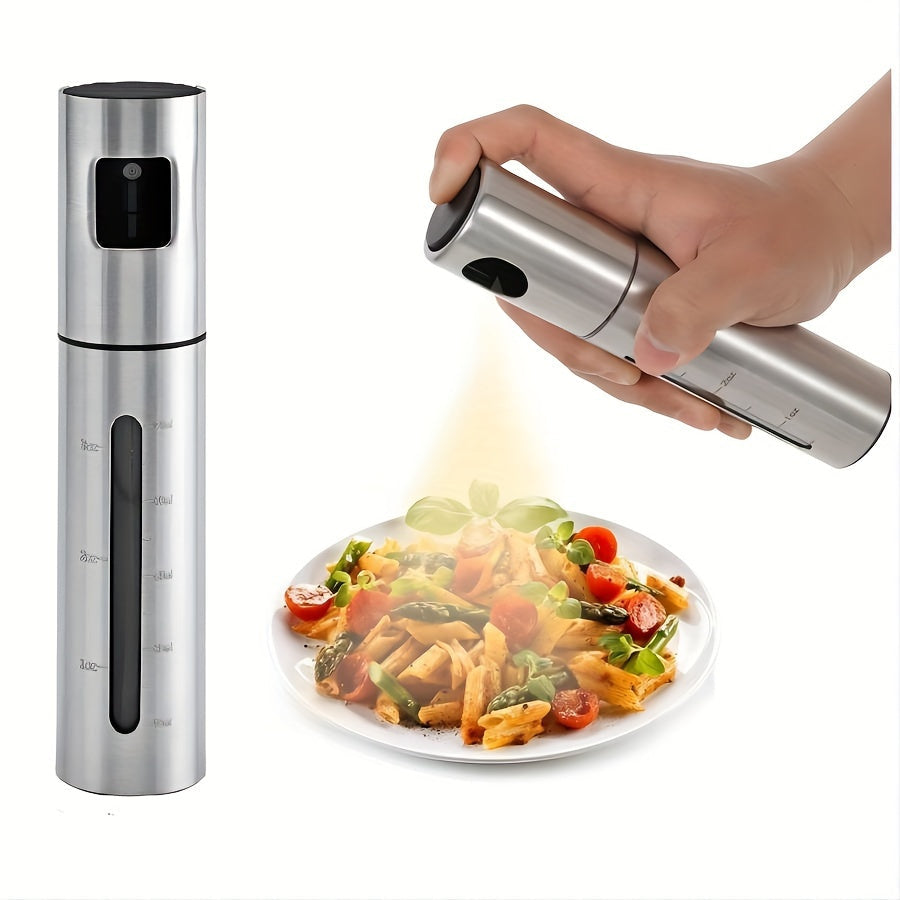 A 100ml stainless steel oil spray bottle for household kitchen use, perfect for seasoning and barbecuing with olive oil.