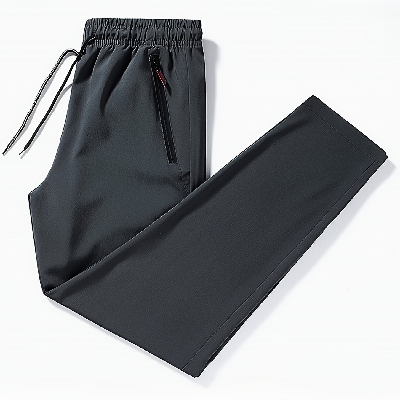 Men's Plus Size Casual Black Joggers, made of breathable, lightweight polyester with zipper pockets and a drawstring waist. Ideal for sports and leisure in spring/summer.