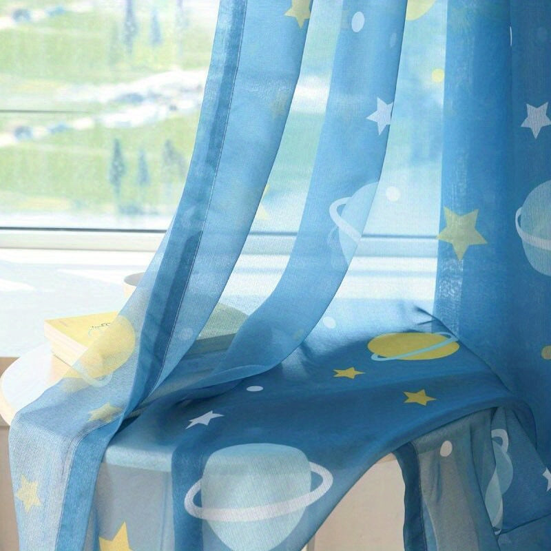 Blue cartoon kids curtain with star and planet print, ideal for boys' room decor. Grommet top design adds a dreamy touch to the window.