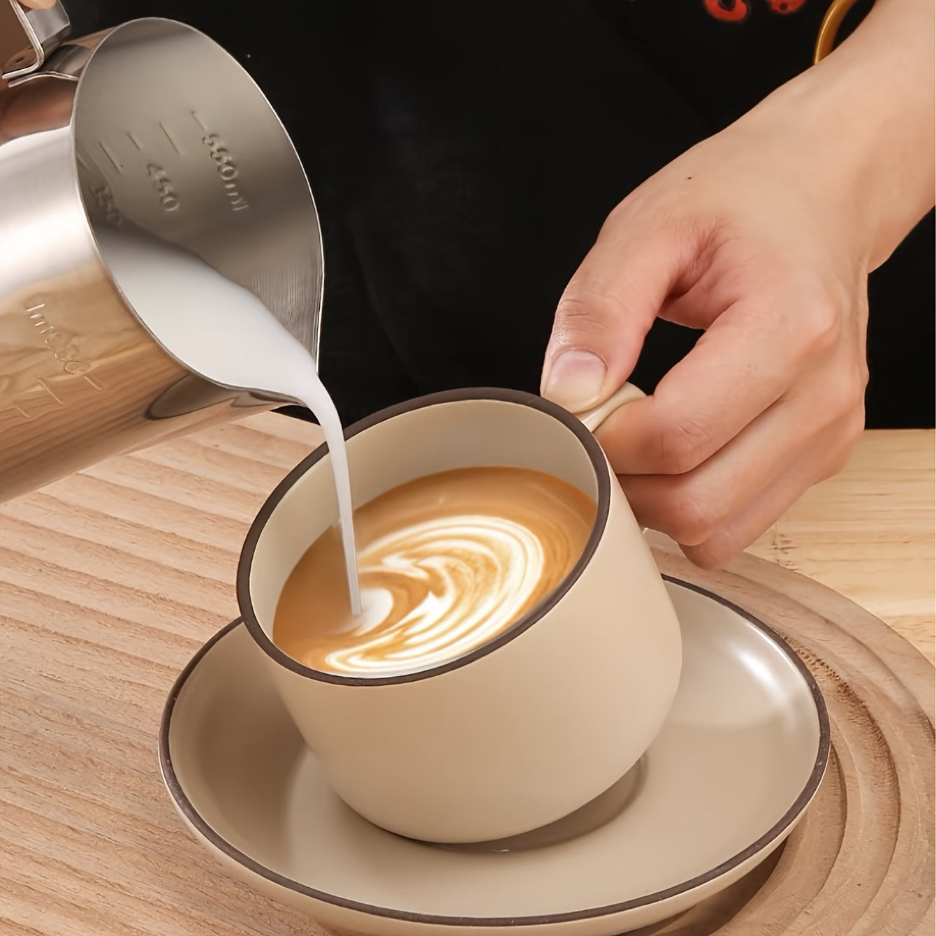 The Stainless Steel Coffee Art Cup is perfect for creating beautiful latte art, cappuccinos, and iced teas. Featuring convenient measurement marks and a large capacity, this milk frothing pitcher is available in 350ml, 600ml, and 900ml sizes.