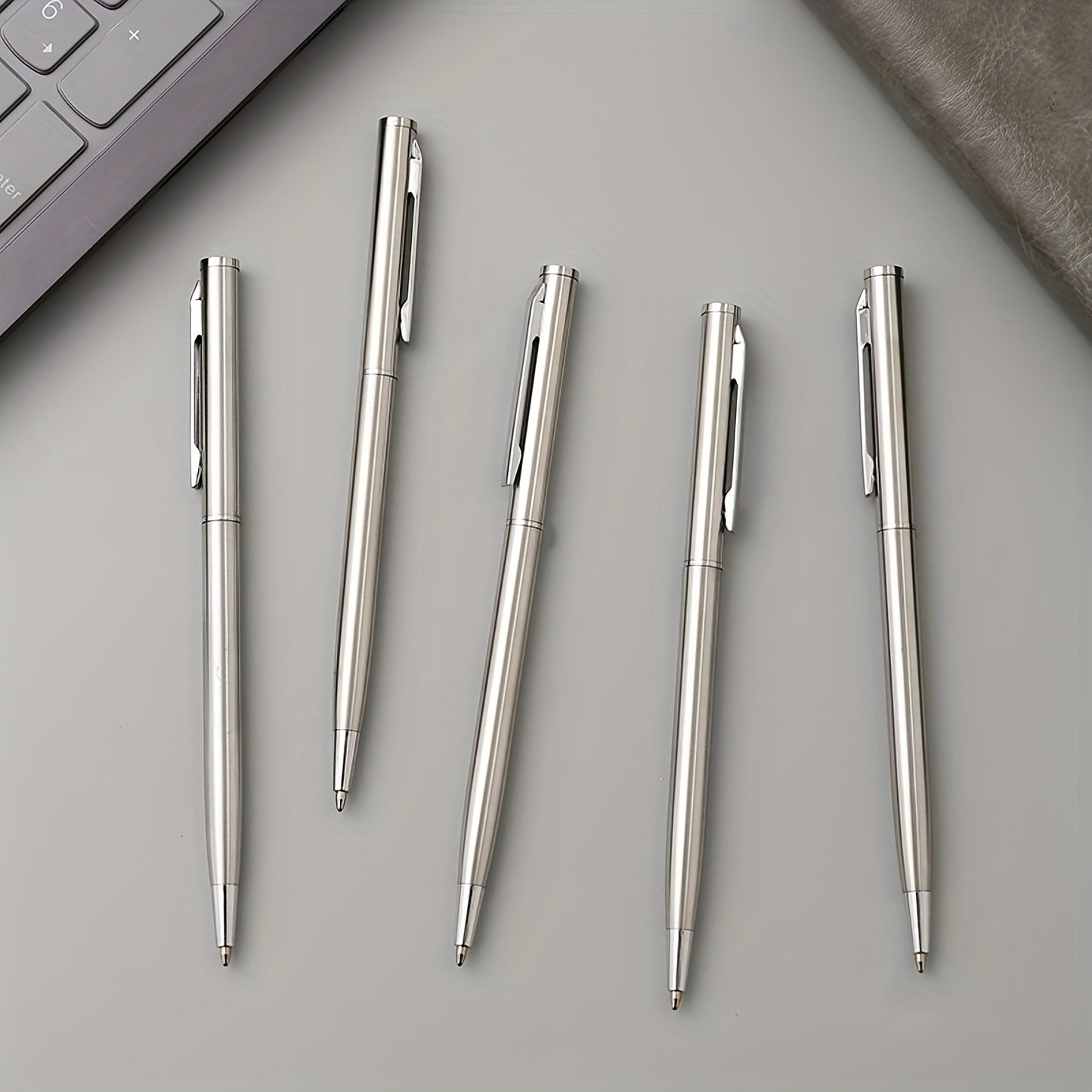 5 elegant silvery stainless steel ballpoint pens with durable medium points, twist action, and smooth writing for adults 14+. Ideal for office use and gifting.