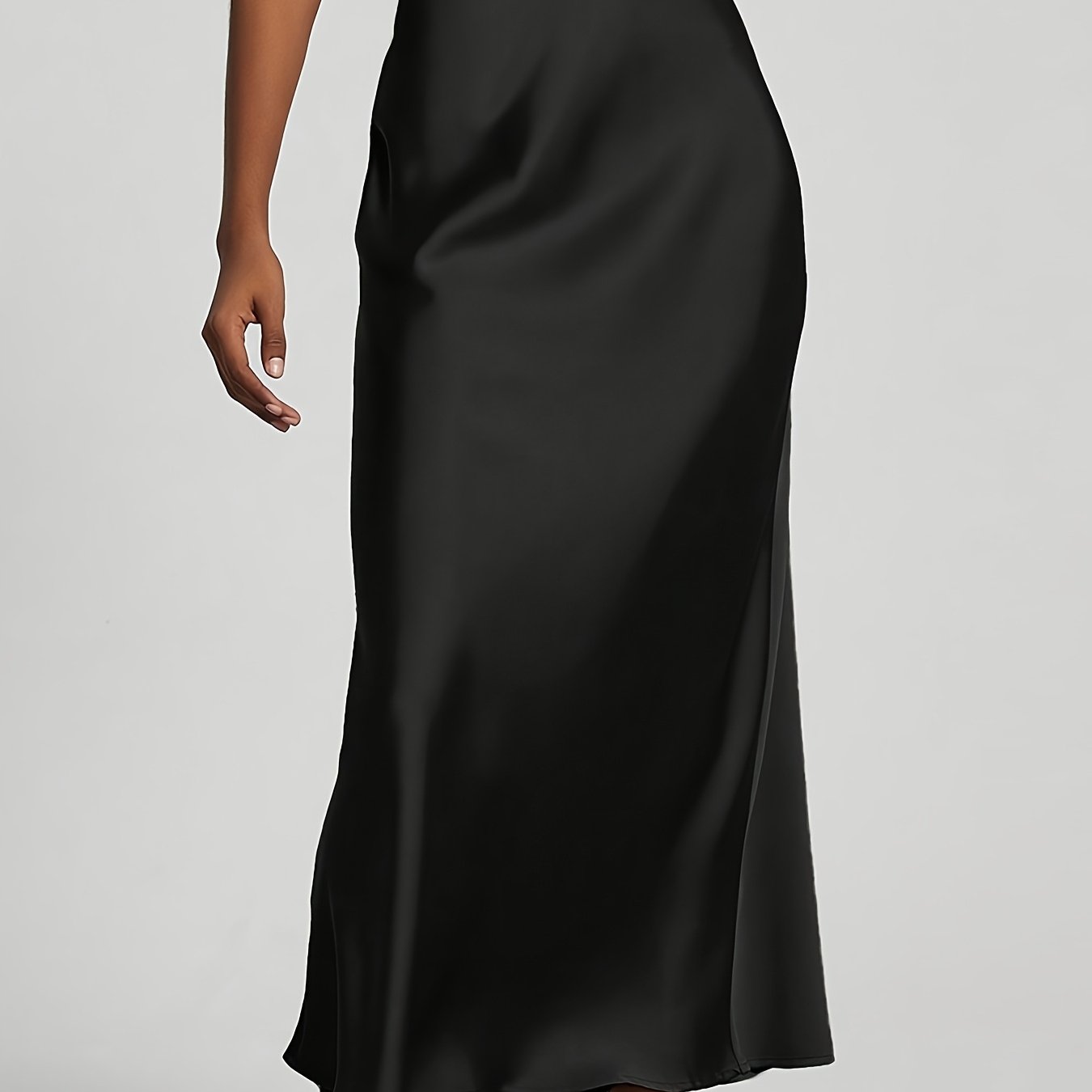 Elegant black high-waisted maxi skirt with A-line cut and smooth satin fabric, perfect for any occasion. Casual chic at its best.