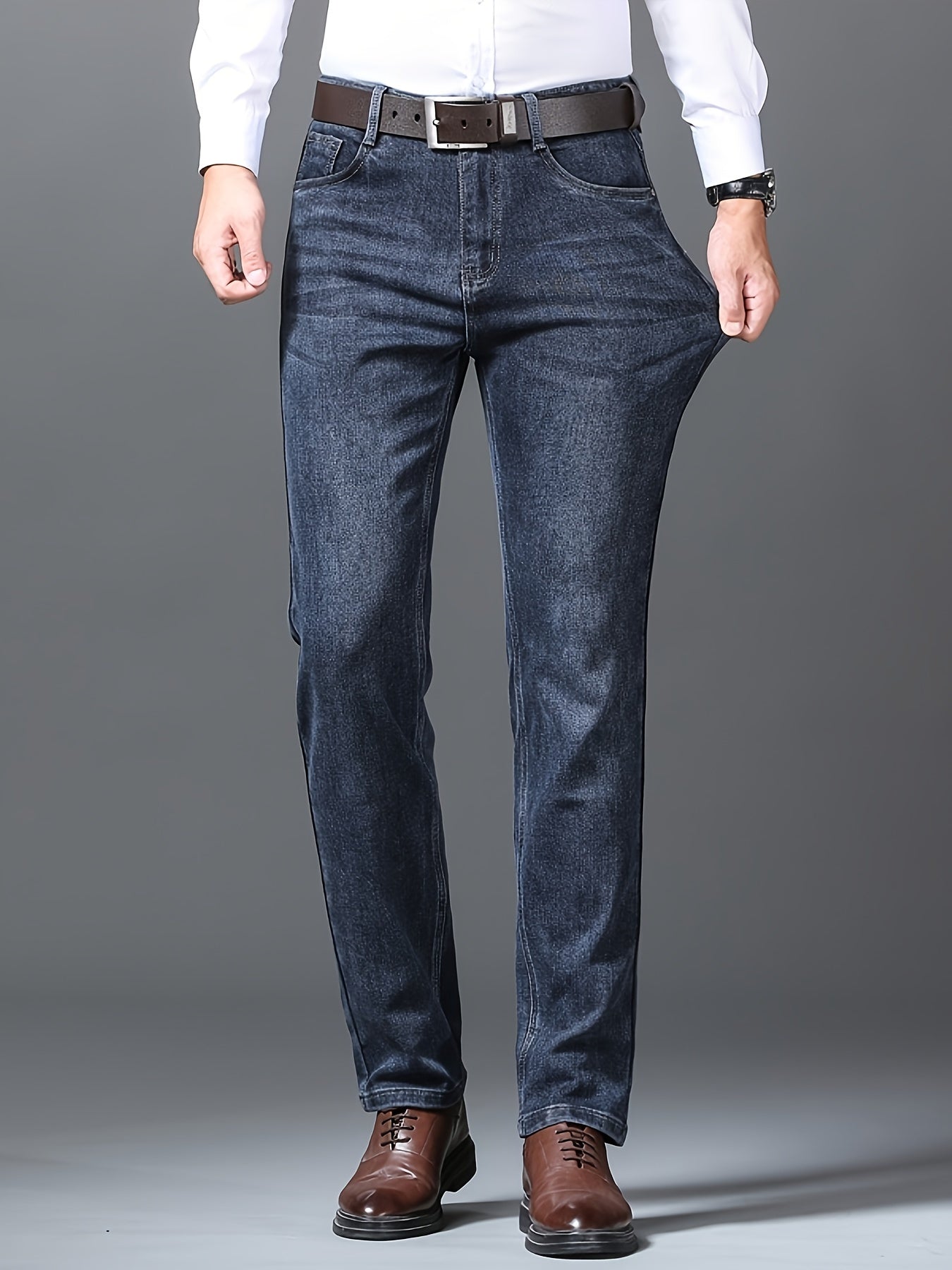 Men's semi-formal stretch denim pants with classic straight leg design and pockets, ideal for fall and winter.