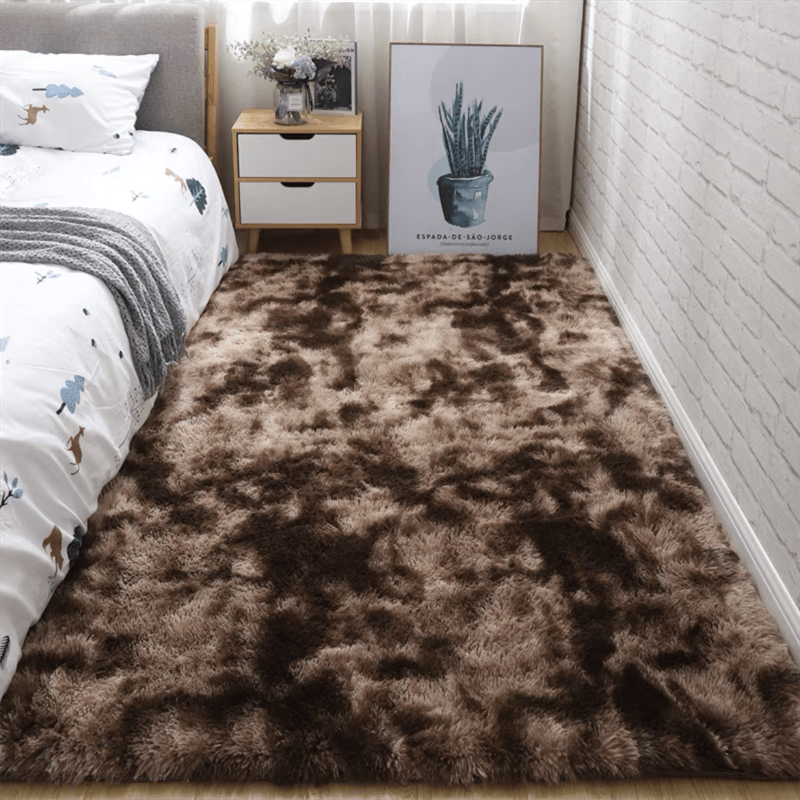 Soft plush area rug, perfect for any room in your home! This non-slip fuzzy shag rug is ideal for adding a touch of luxury to your bedroom or living room. The tie-dyed design adds a unique and stylish touch to your decor. Made with pet-friendly