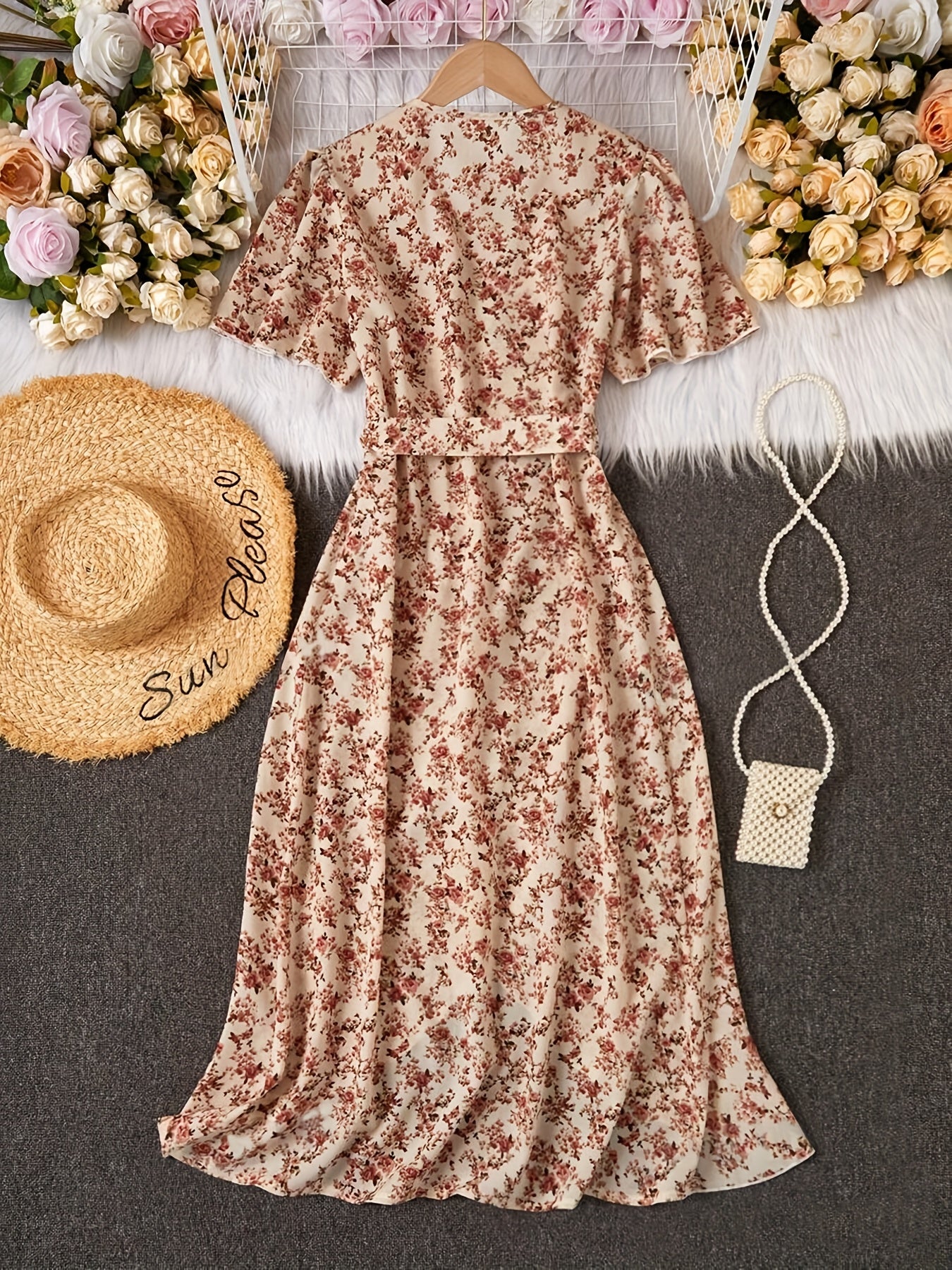 Women's elegant floral dress with bohemian ruffle sleeves, criss cross neckline, and lace-up detail. Made with woven polyester fabric, regular fit, includes belt. Suitable for all seasons.