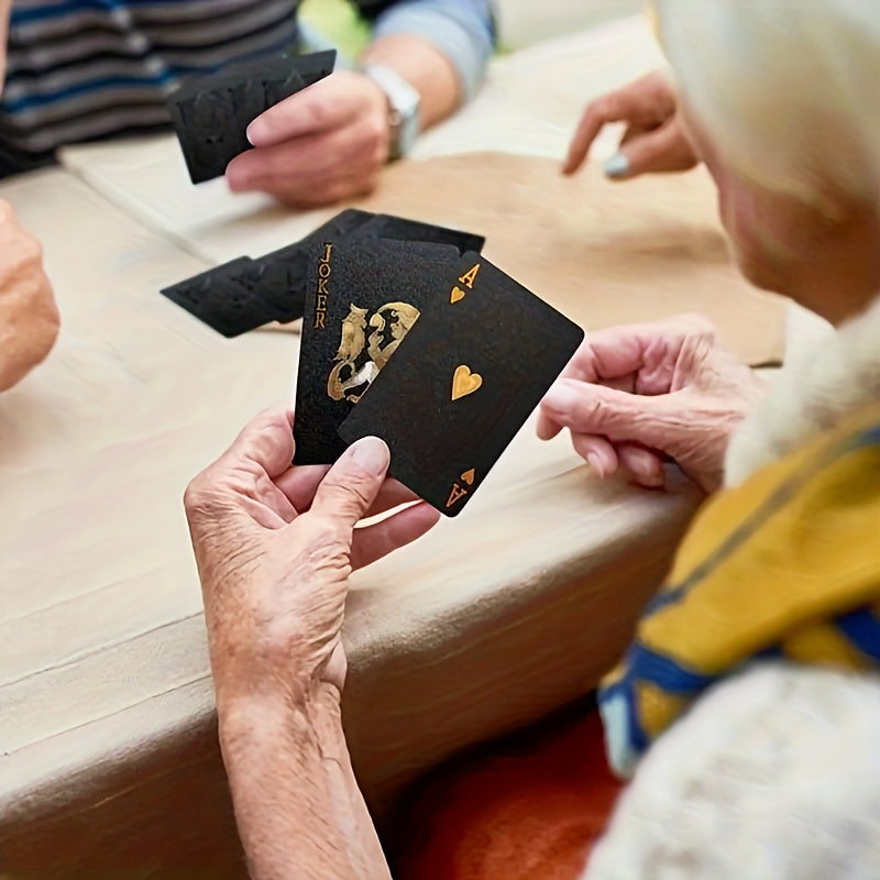 Black gold waterproof playing cards for magic and poker games, packaged in a board game gift collection.