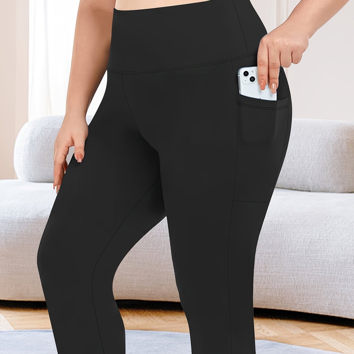 High-waisted capri leggings for plus-size women with side phone pockets, ideal for workouts.