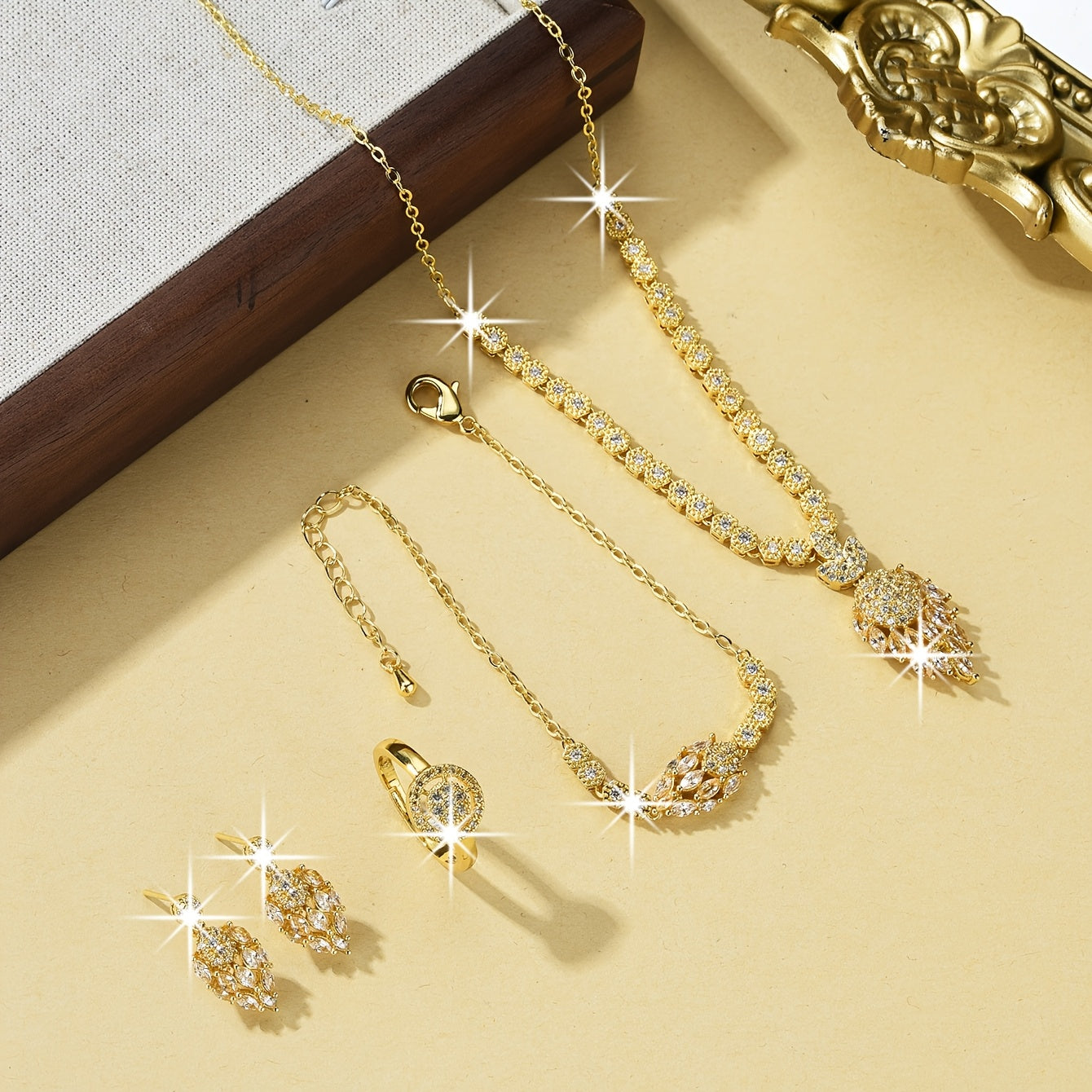 Luxurious Floral Design Women's Bridal Jewelry Set, Featuring 5 Pieces in 18K Gold-Plated Copper with Synthetic Cubic Zirconia Stones. Set includes Necklace, Earrings, and Bracelet. Perfect for Both Daily Wear and Special Wedding Occasions.