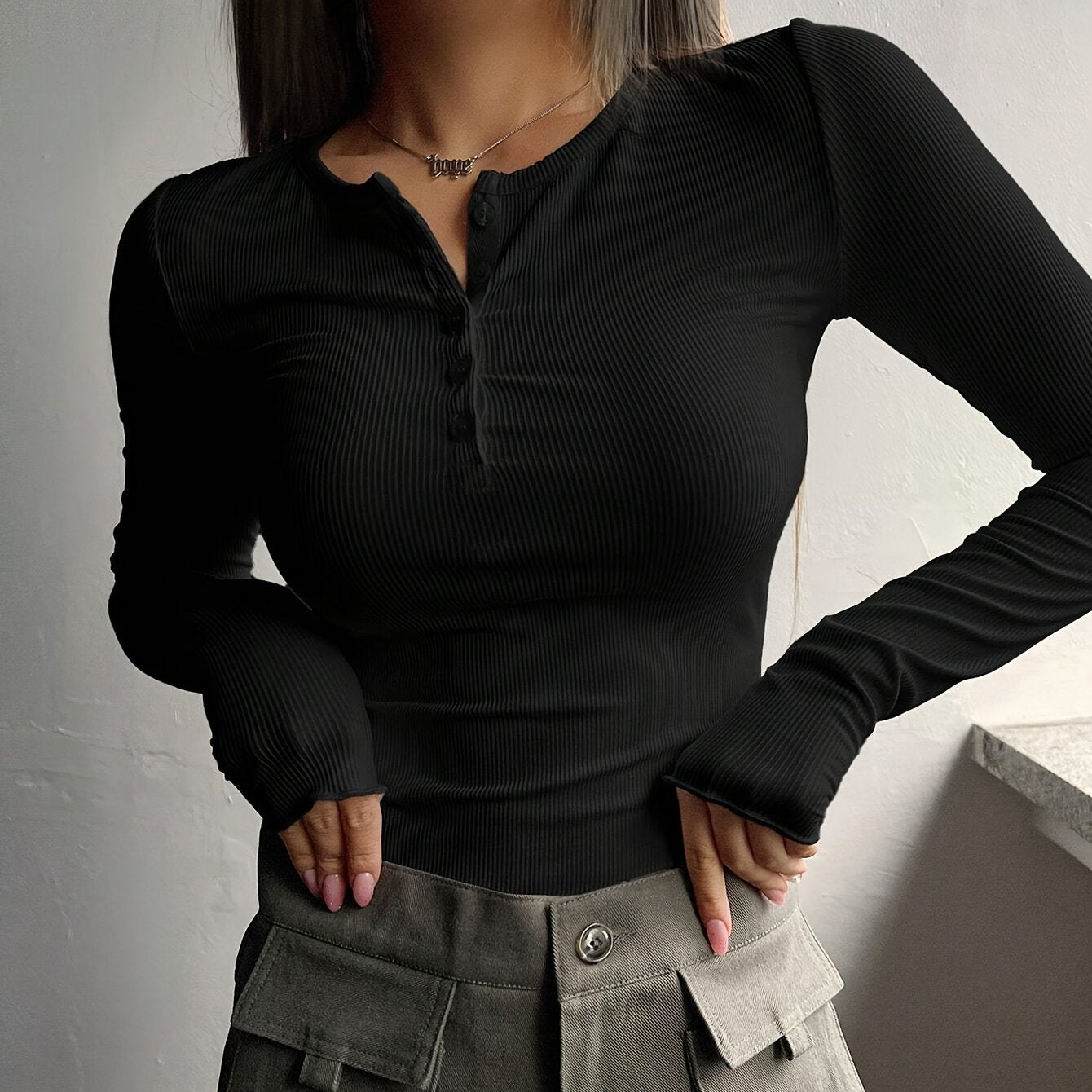 Women's black ribbed knit T-shirt with half-button placket, slim fit, machine washable, suitable for spring/summer.